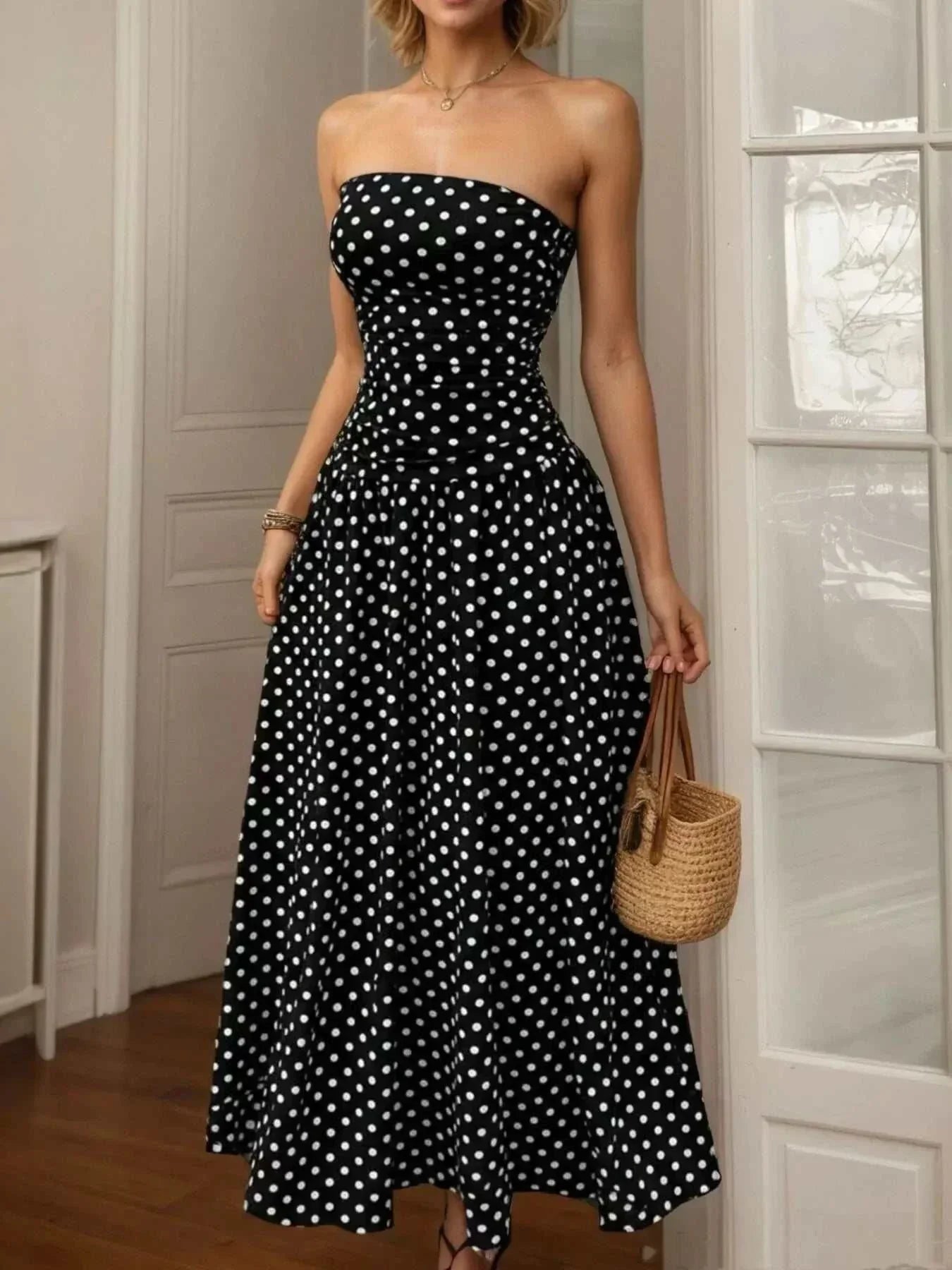 Polka dot strapless maxi dress with slight stretch and machine washable fabric.