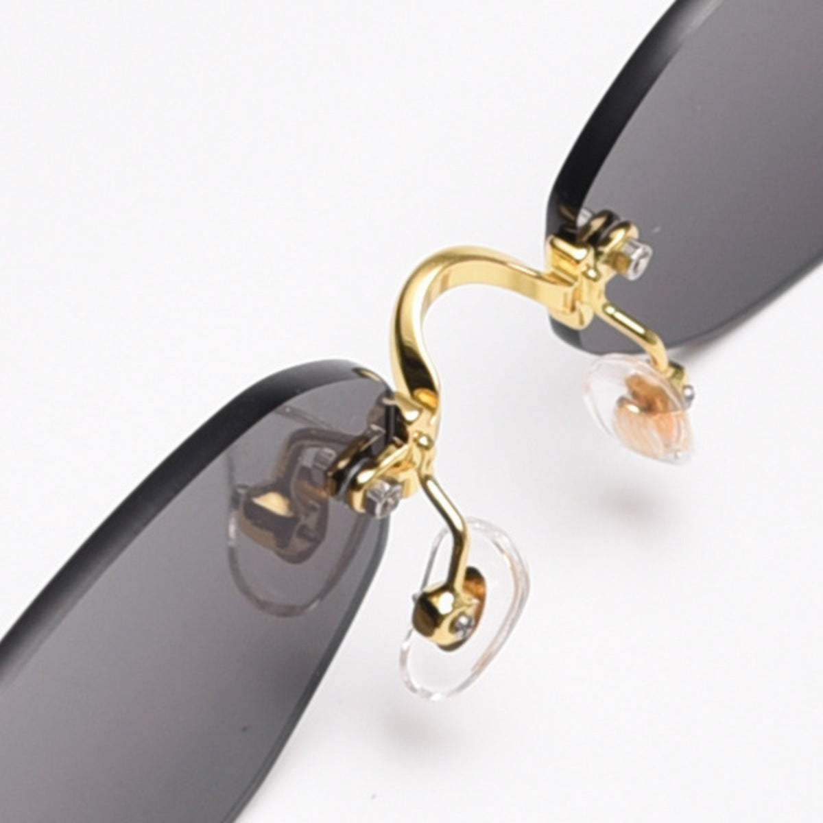 Rimless oval sunglasses with gold metal frame and UV400 protection