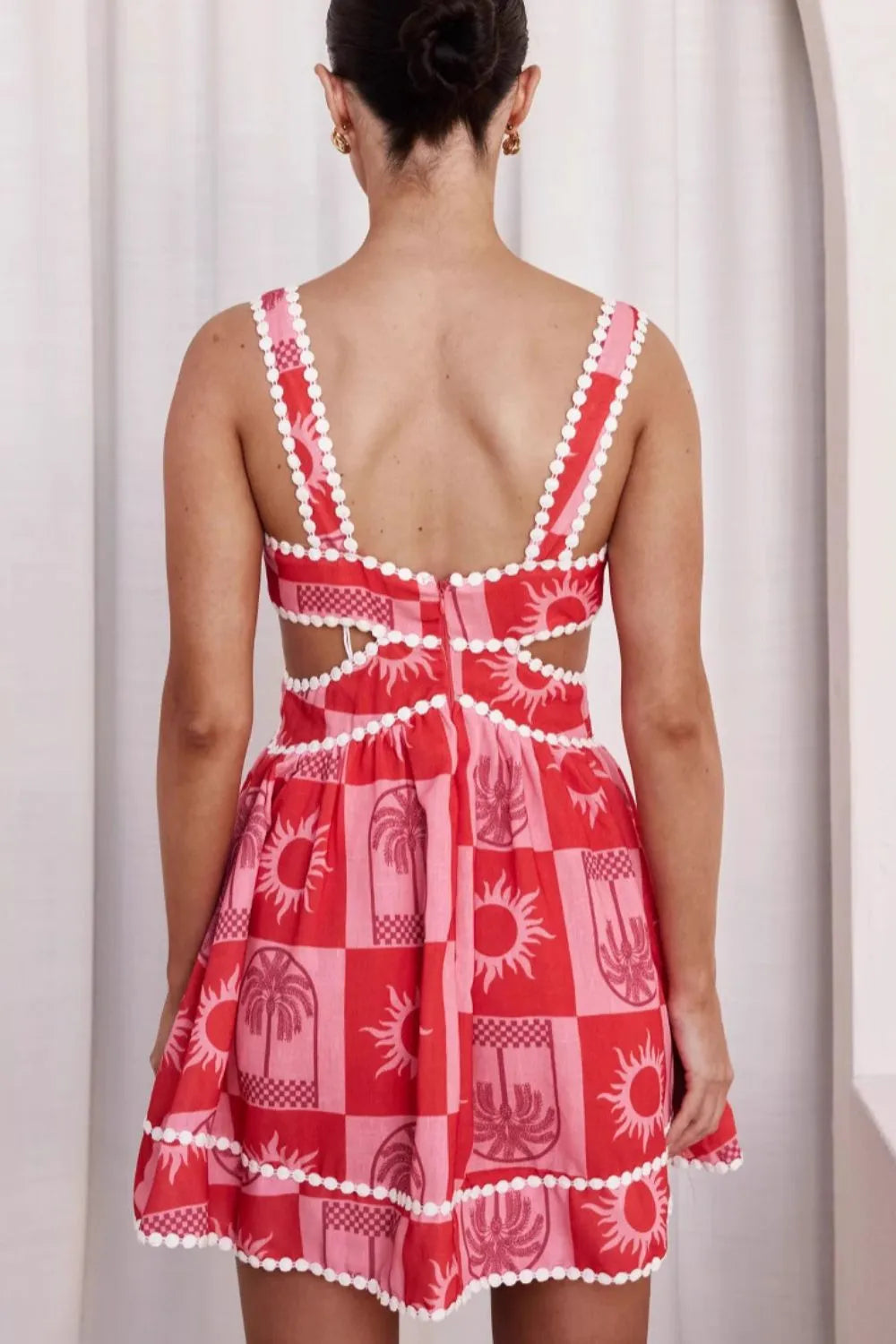 Cutout printed mini dress in polyester with no stretch and machine washable care instructions