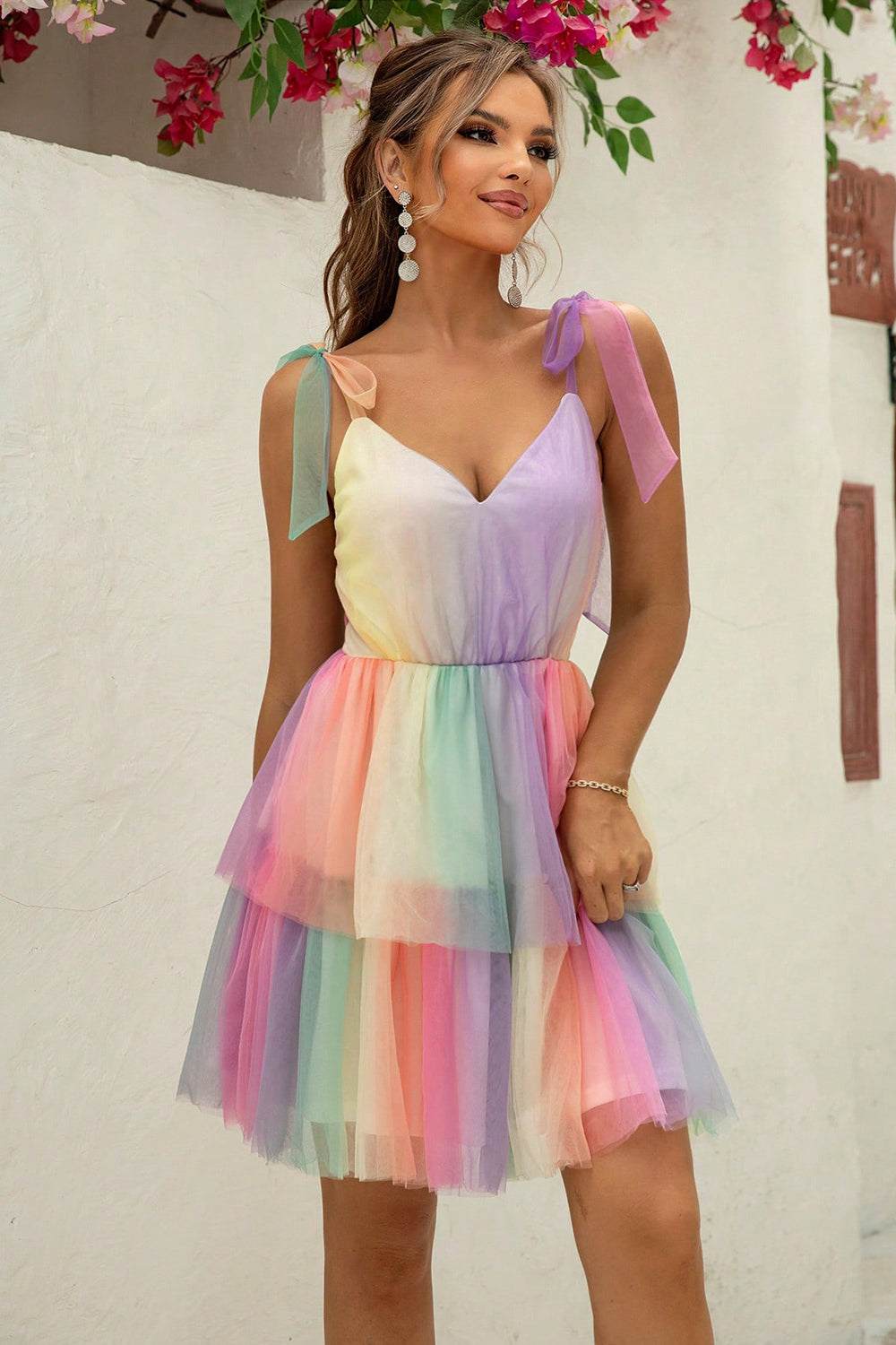 Woman wearing a gradient tie-shoulder layered dress with slight stretch and opaque fabric