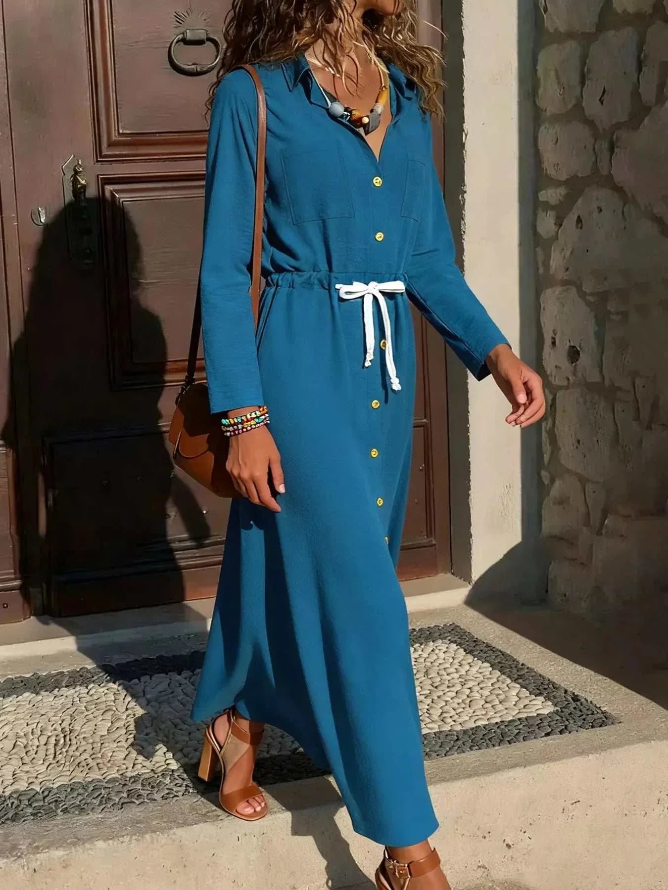 Button-down long sleeve dress with buttons, pockets, and drawstring, polyester blend, no stretch, available in multiple sizes