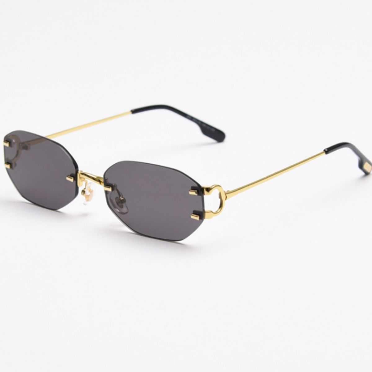 Rimless oval sunglasses with gold metal frame and UV400 protection