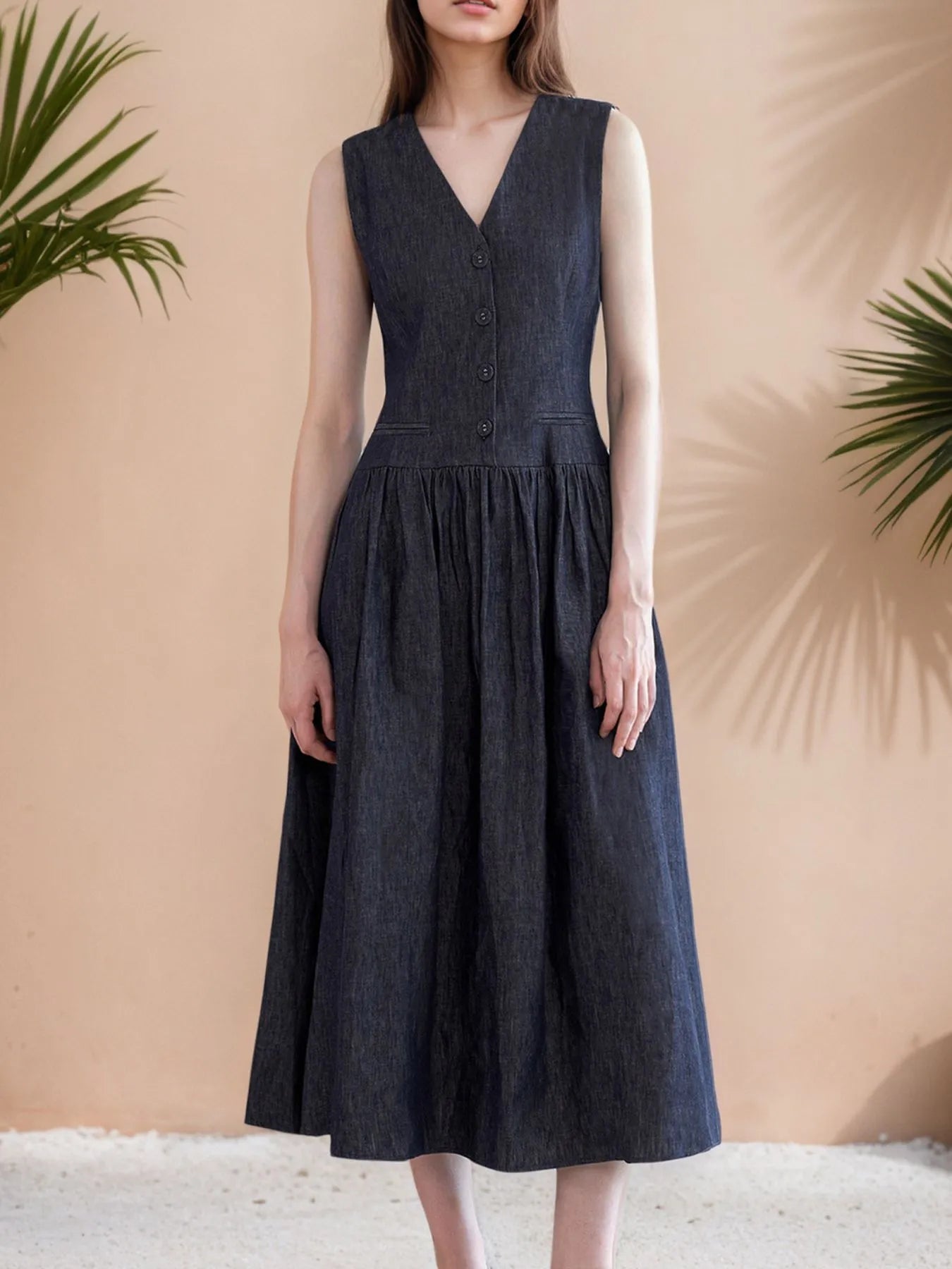 Black buttoned V-neck sleeveless midi dress with partial lining and no stretch fabric
