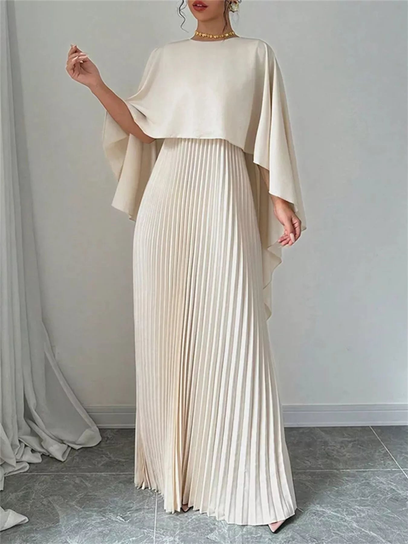 Cape pleated maxi dress in 100% polyester with no stretch and machine washable design
