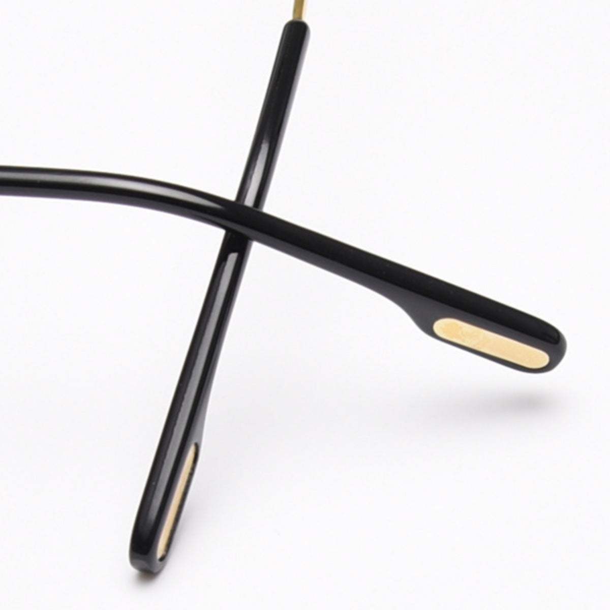 Rimless oval sunglasses with gold metal frame and UV400 protection