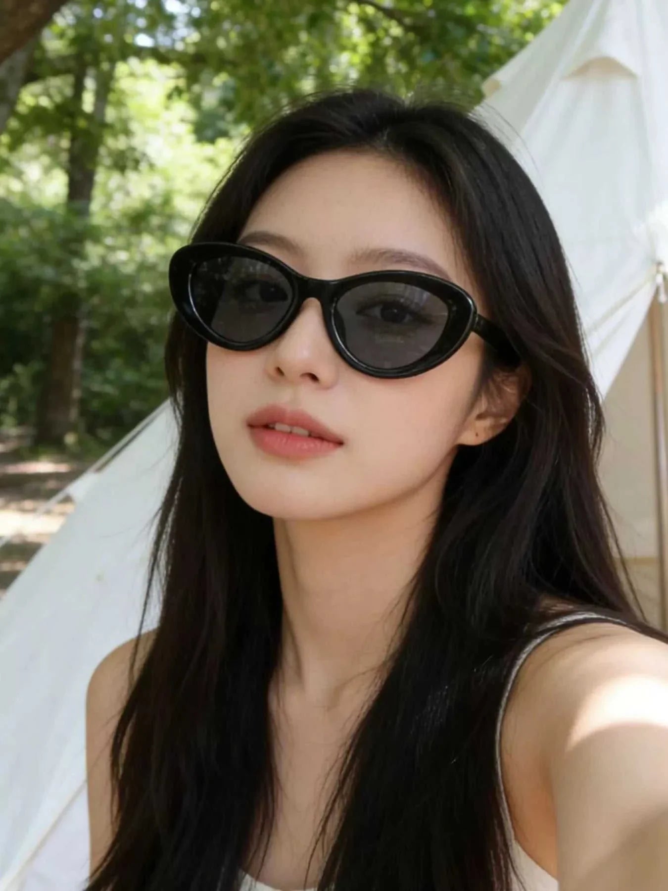 Sleek black cat eye sunglasses with UV400 protection and polycarbonate frame